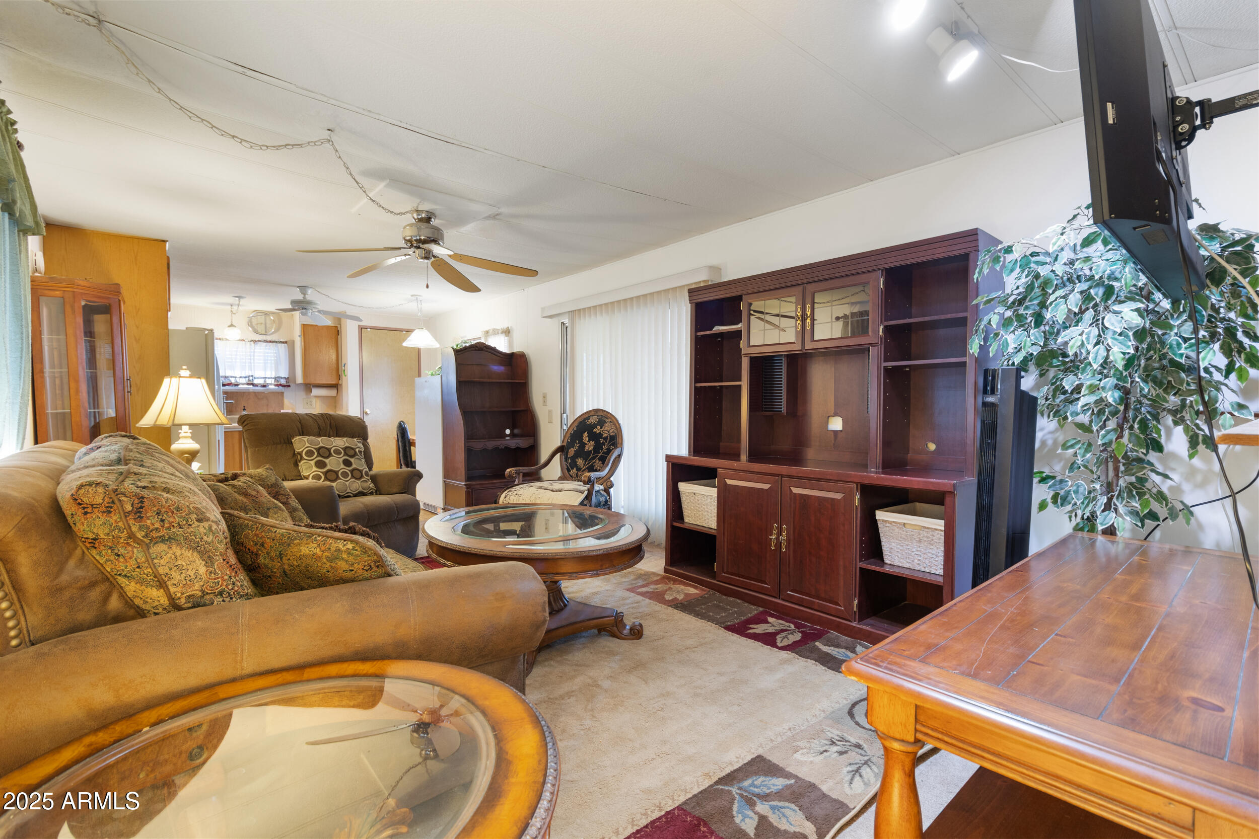 701 South Dobson Road, Unit 16 Mesa, AZ 85202 - Photo 9 of 55 a living room with furniture and a flat screen tv