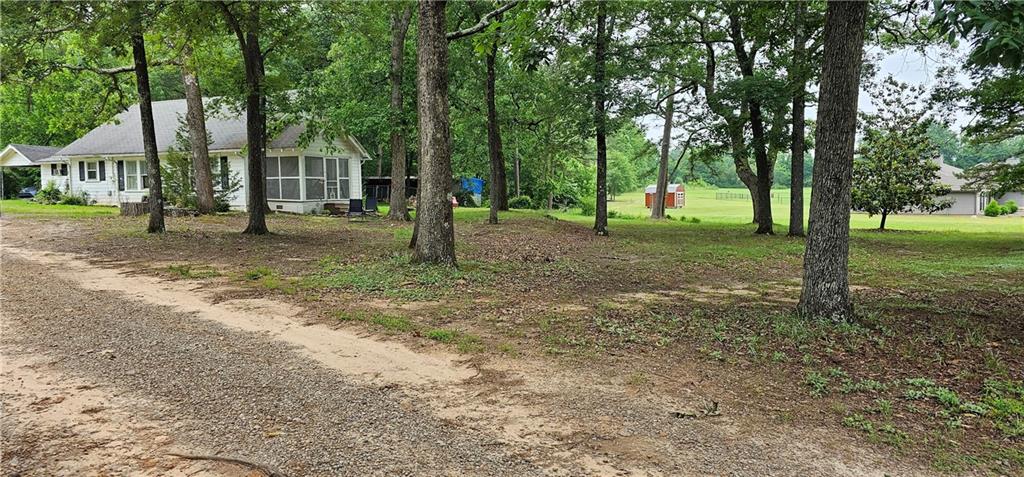 263 Jordan Cofer Road Statham, GA 30666 - Photo 1 of 1 a view of a yard with tree s