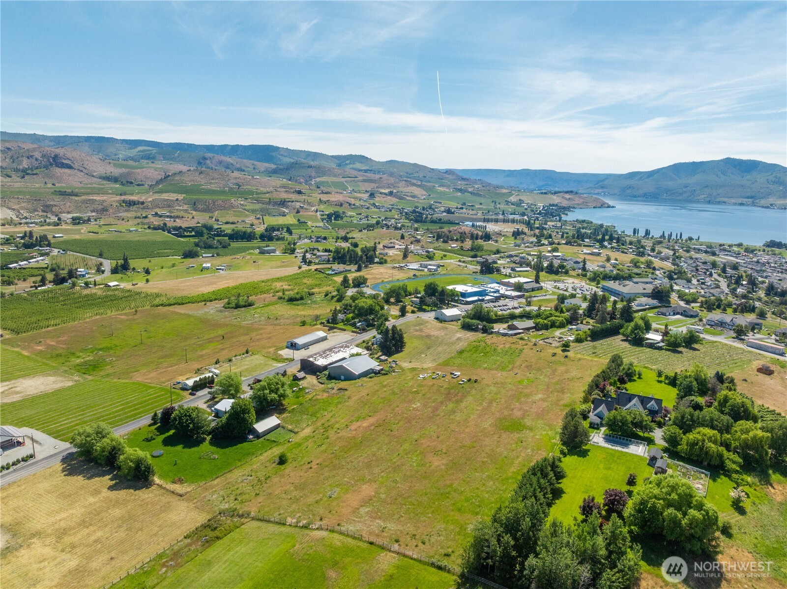1281 Totem Pole Road Manson, WA 98831 - Photo 34 of 39 a view of a city with mountains in the background
