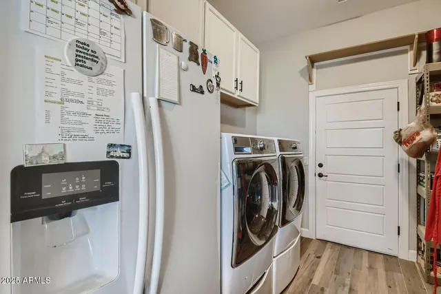 a view of a patio with lawn chairs floor to ceiling window and yard