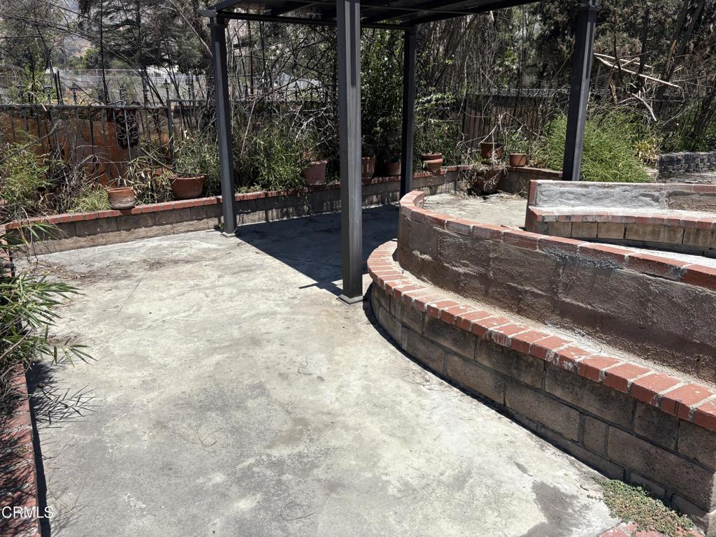 1125 Rubio Street Altadena, CA 91001 - Photo 20 of 23 a view of swimming pool with a patio and wooden fence
