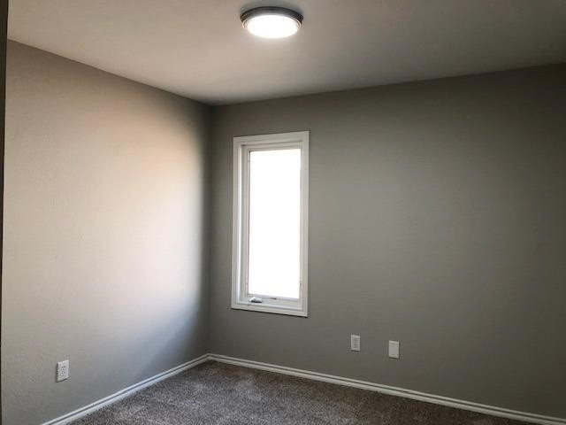 4412 Jarvis Street, Unit 2 Lubbock, TX 79416 - Photo 12 of 16 an empty room with a window