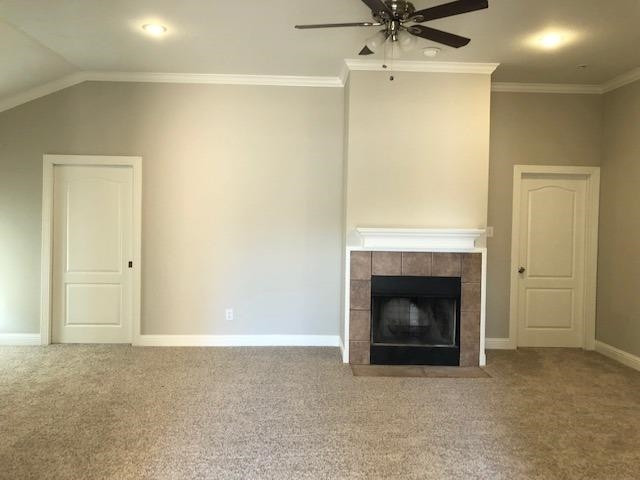4412 Jarvis Street, Unit 2 Lubbock, TX 79416 - Photo 5 of 16 a living room with a fireplace and a ceiling fan