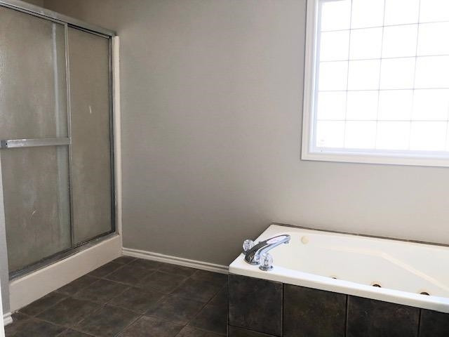 4412 Jarvis Street, Unit 2 Lubbock, TX 79416 - Photo 9 of 16 a room with a window and wooden floor