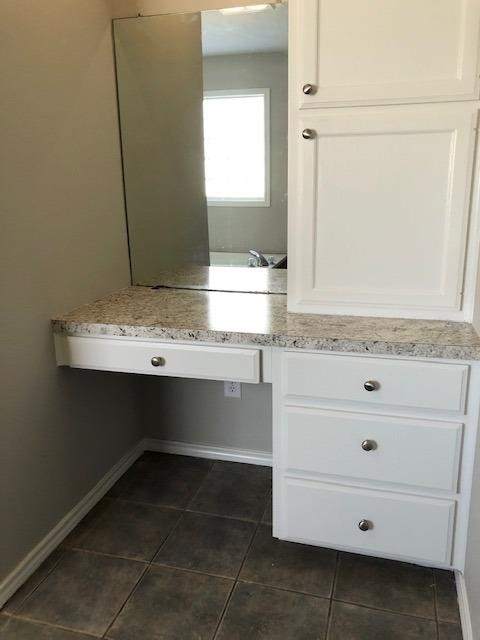 4412 Jarvis Street, Unit 2 Lubbock, TX 79416 - Photo 10 of 16 a bathroom with a sink and a mirror