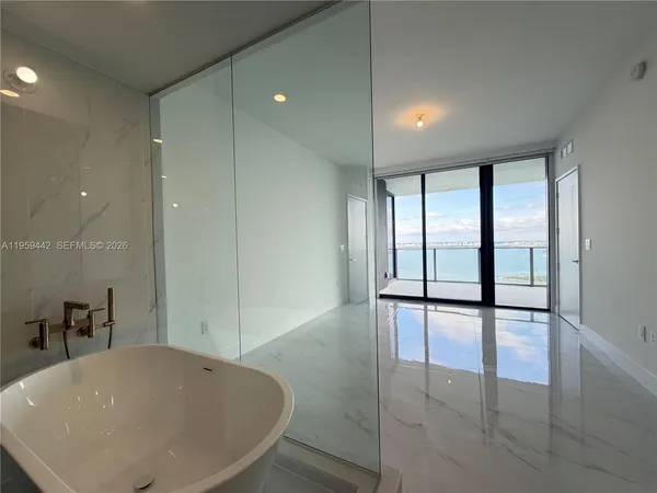 a bathroom with a double vanity sink and mirror