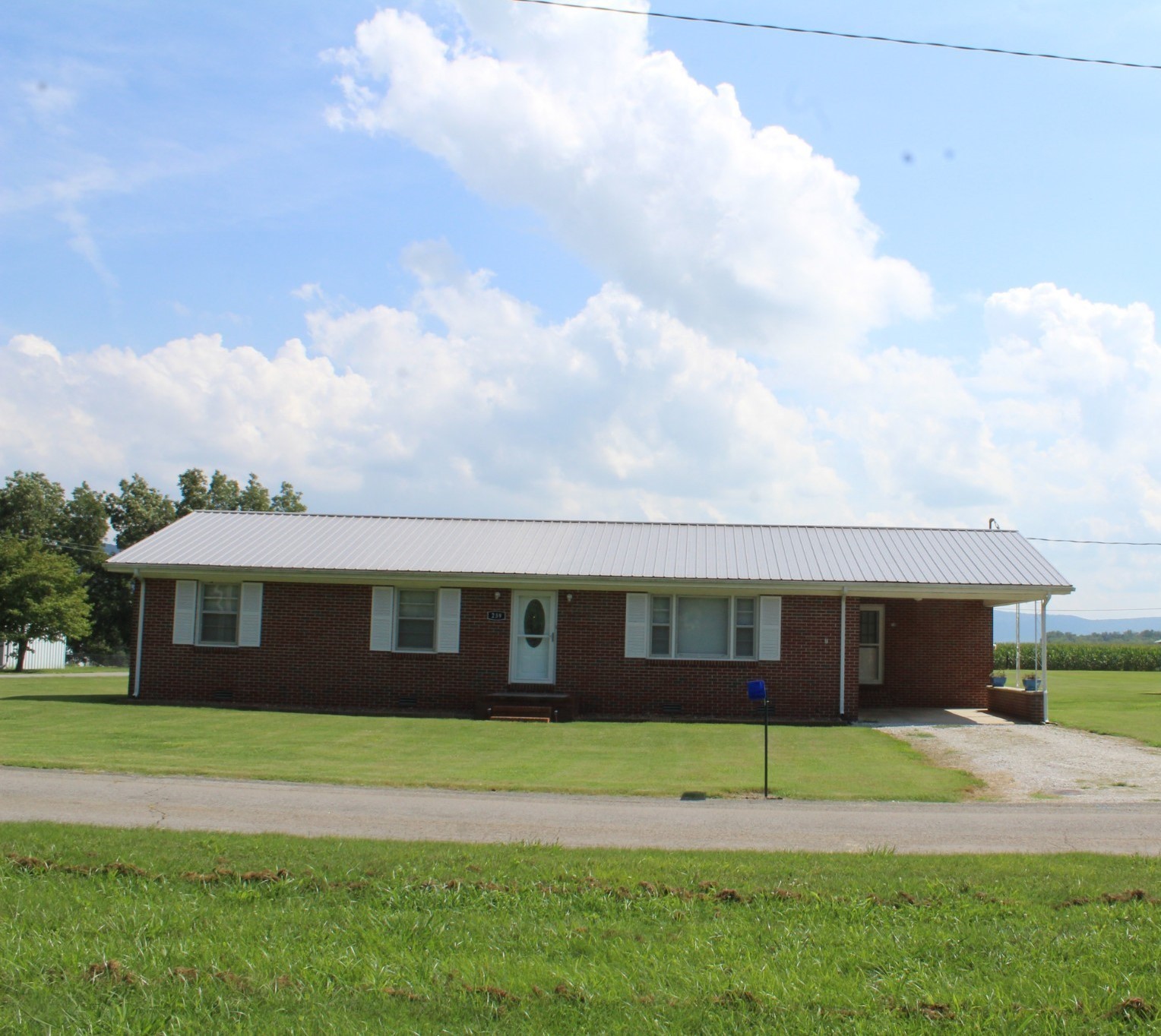 a view of house with yard and entertaining space