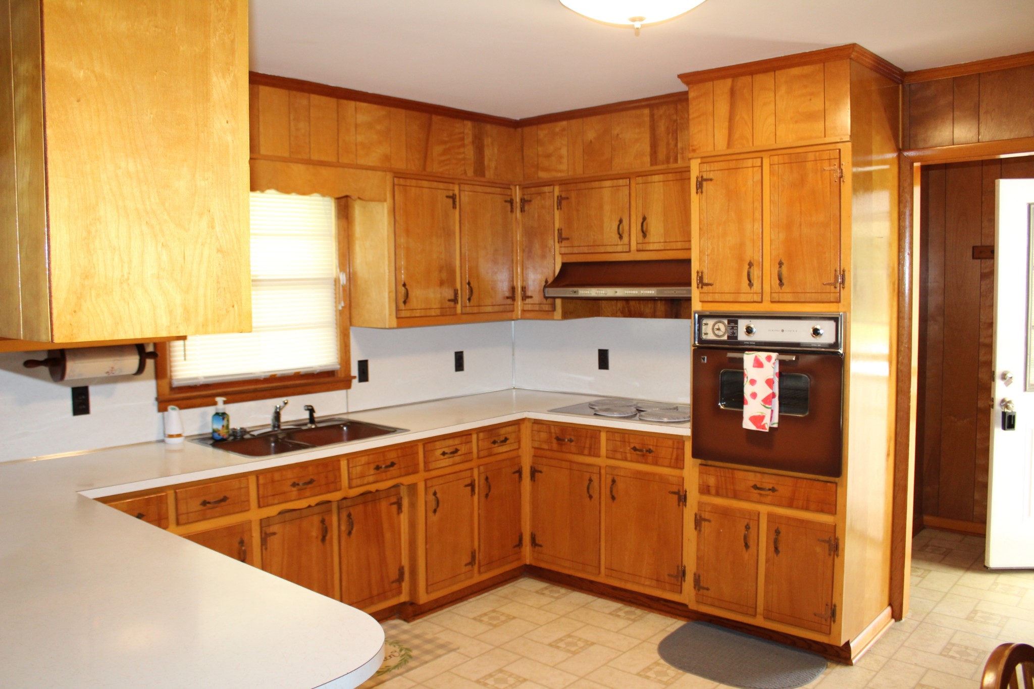 239 Mill Street Viola, TN 37357 - Photo 11 of 27 a kitchen with stainless steel appliances granite countertop a sink and cabinets with wooden floor