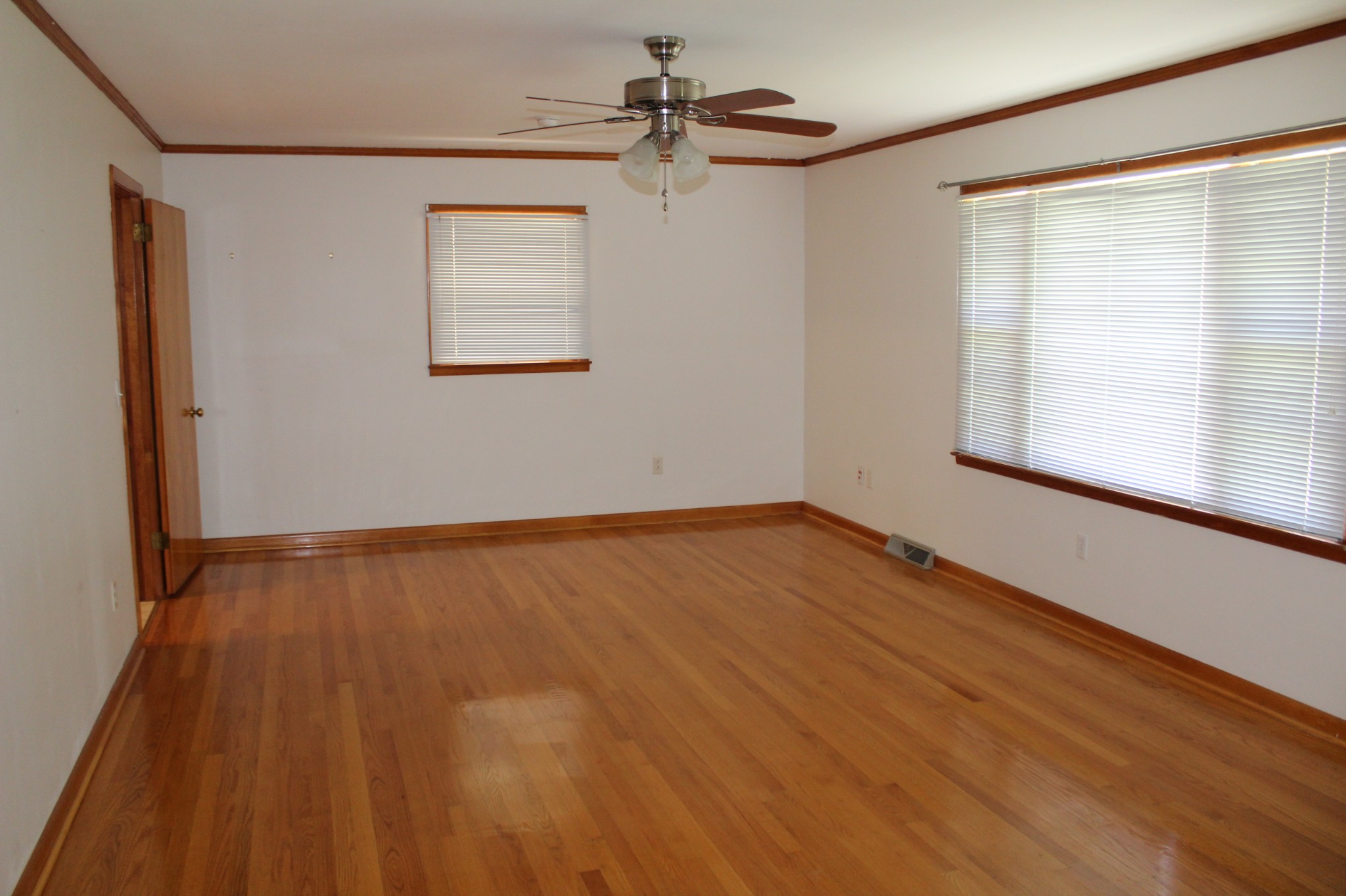239 Mill Street Viola, TN 37357 - Photo 13 of 27 wooden floor in an empty room with a window