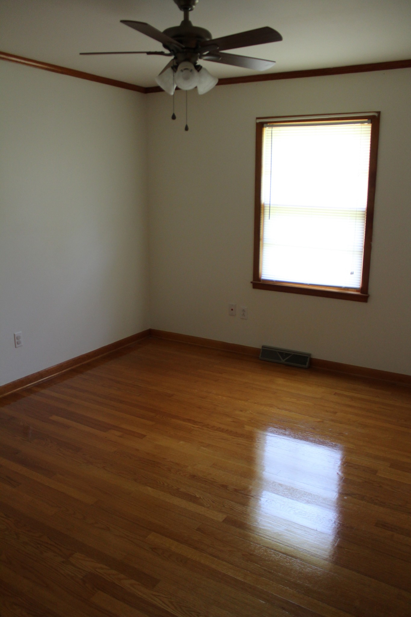 239 Mill Street Viola, TN 37357 - Photo 16 of 27 en empty room with wooden floor fan and windows