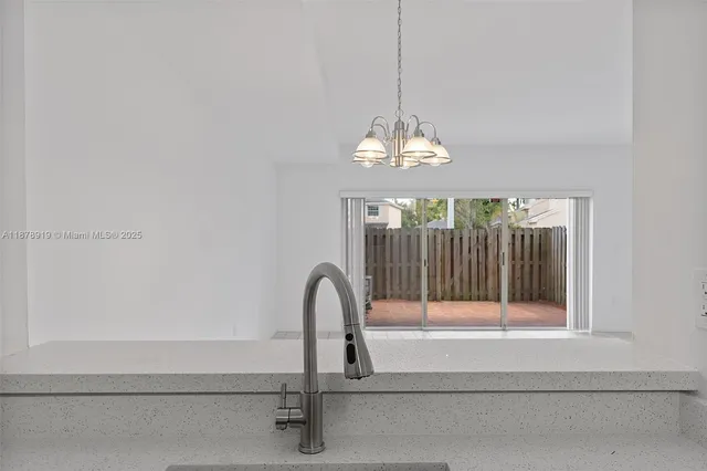 a view of a chandelier in a livingroom