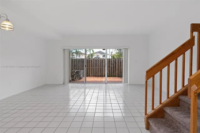a view of an empty room with windows