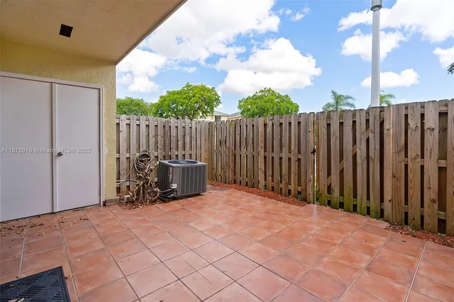 a view of outdoor space with wooden fence