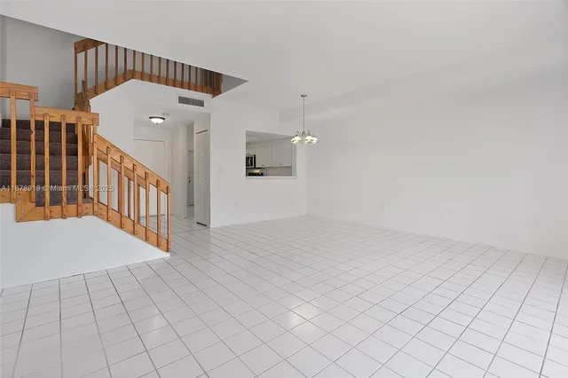 a view of a hallway with a chandelier