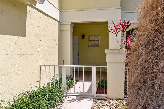 a view of a balcony with a potted plant