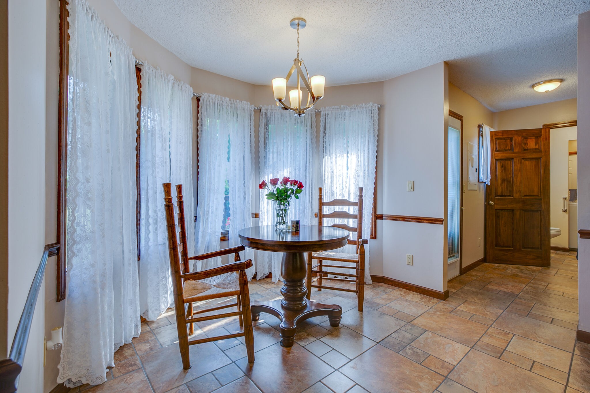 2231 North Road Murfreesboro, TN 37128 - Photo 16 of 45 a view of a dining room with furniture and chandelier