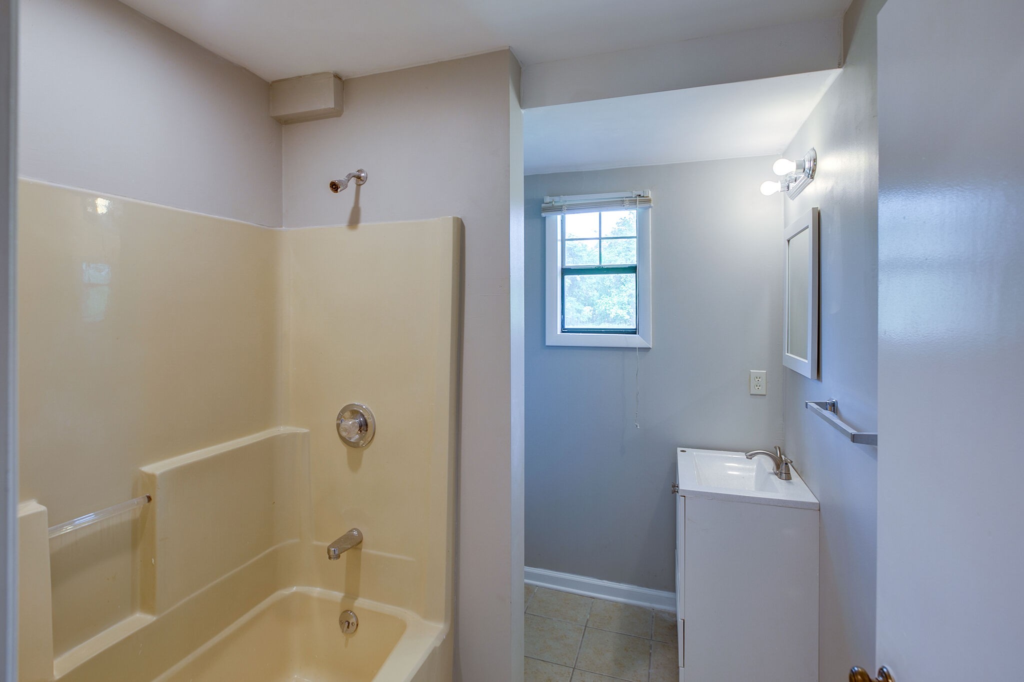 2231 North Road Murfreesboro, TN 37128 - Photo 41 of 45 a bathroom with a tub shower vanity and a sink