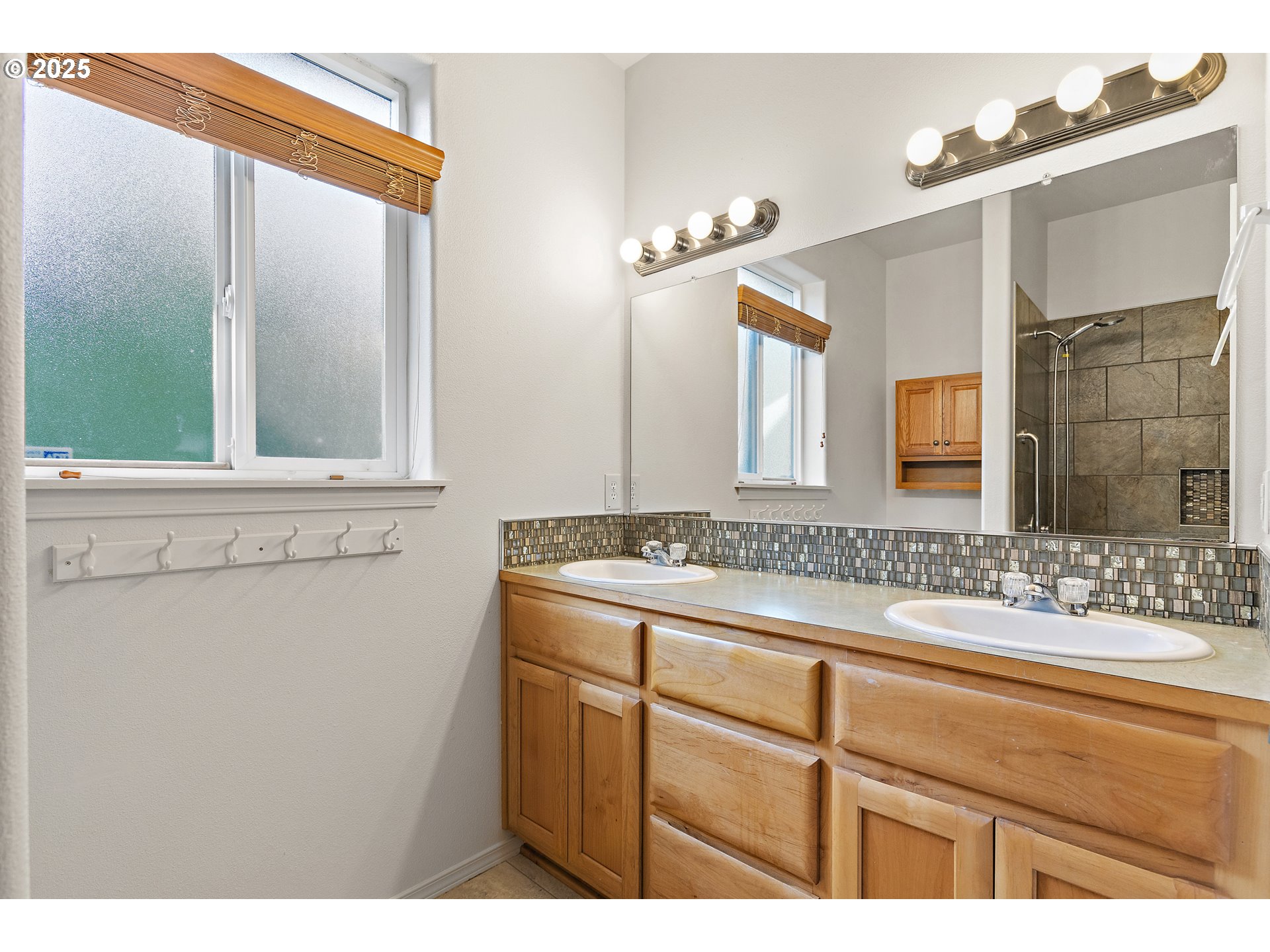 2812 Northeast 120th Avenue Vancouver, WA 98682 - Photo 14 of 27 a bathroom with a sink and a mirror