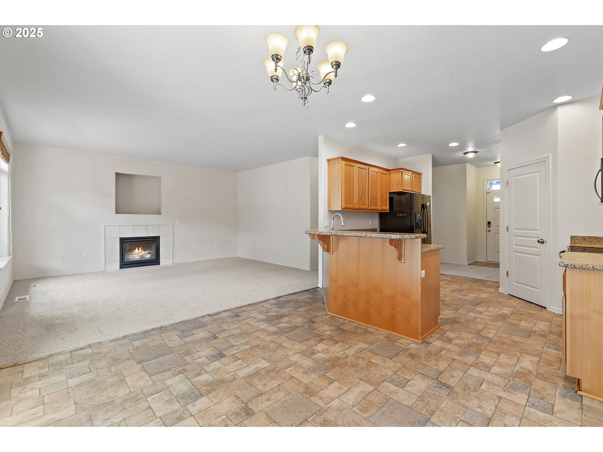 2812 Northeast 120th Avenue Vancouver, WA 98682 - Photo 4 of 27 a view of a kitchen with a sink stainless steel appliances and a chandelier