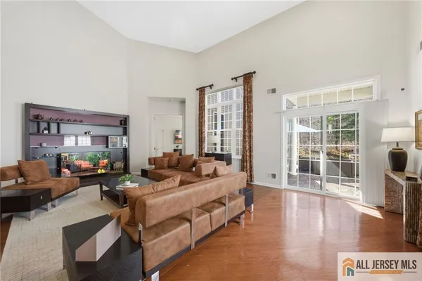 a kitchen with stainless steel appliances granite countertop a sink refrigerator and cabinets