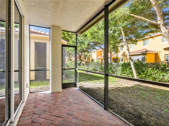 a view of a porch with a floor to ceiling window