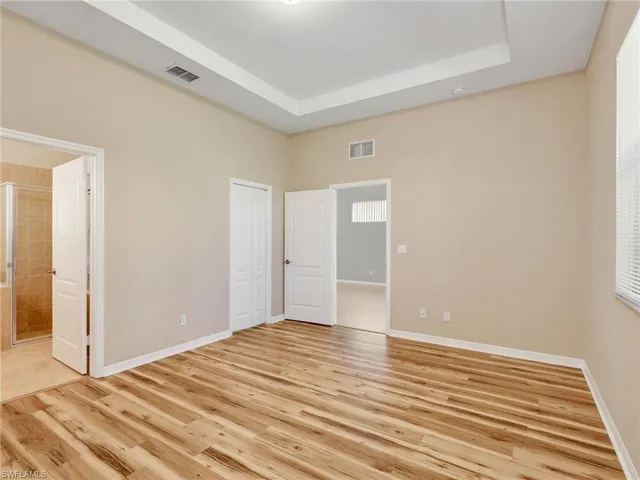 a view of a livingroom with wooden floor and closet