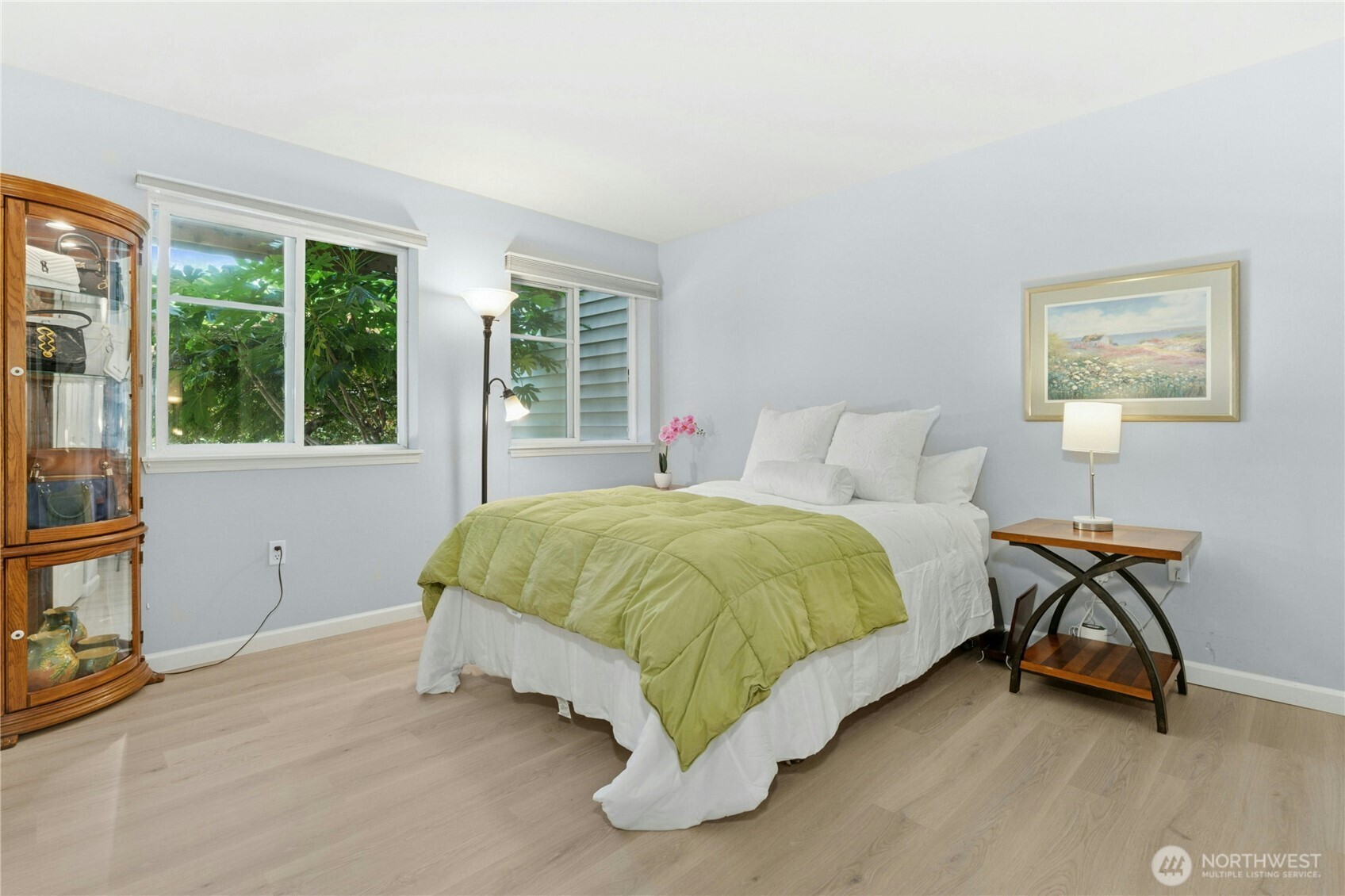 17426 Bothell Way Northeast, Unit A105 Bothell, WA 98011 - Photo 13 of 29 a bed sitting in a bedroom next to a window