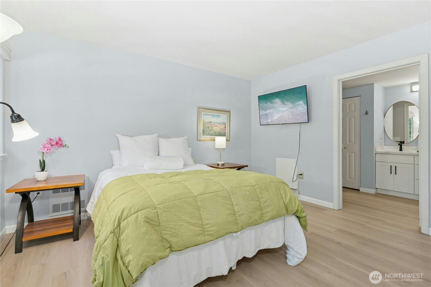 17426 Bothell Way Northeast, Unit A105 Bothell, WA 98011 - Photo 15 of 29 a bedroom with a bed and wooden floor