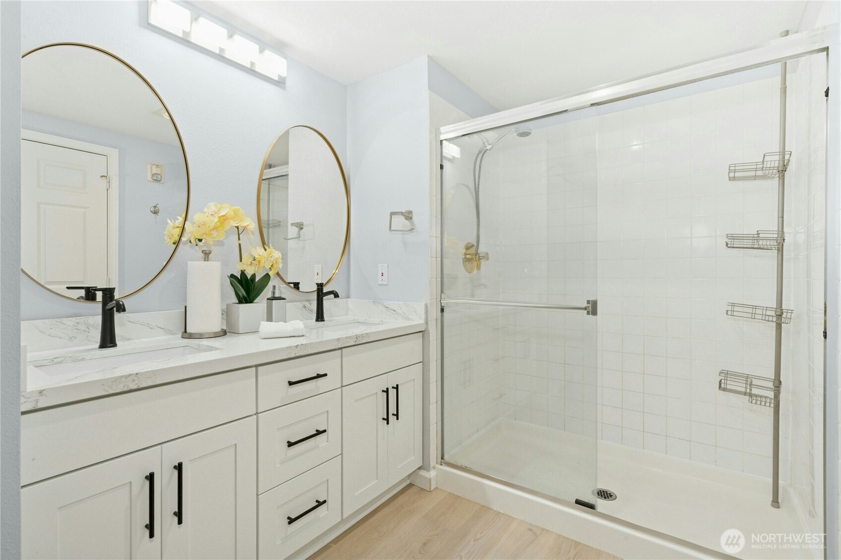 17426 Bothell Way Northeast, Unit A105 Bothell, WA 98011 - Photo 16 of 29 a bathroom with a double vanity sink mirror and shower