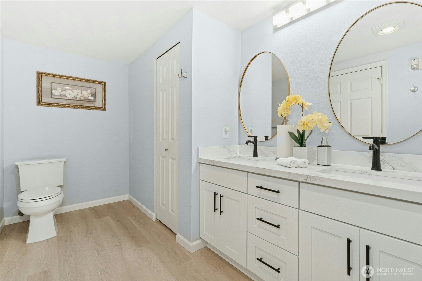 17426 Bothell Way Northeast, Unit A105 Bothell, WA 98011 - Photo 17 of 29 a bathroom with a double vanity sink and a mirror