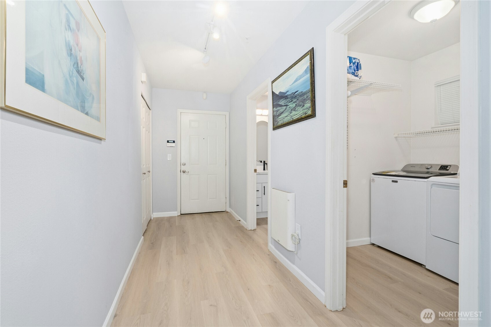 17426 Bothell Way Northeast, Unit A105 Bothell, WA 98011 - Photo 19 of 29 a view of a hallway with wooden floor and closet