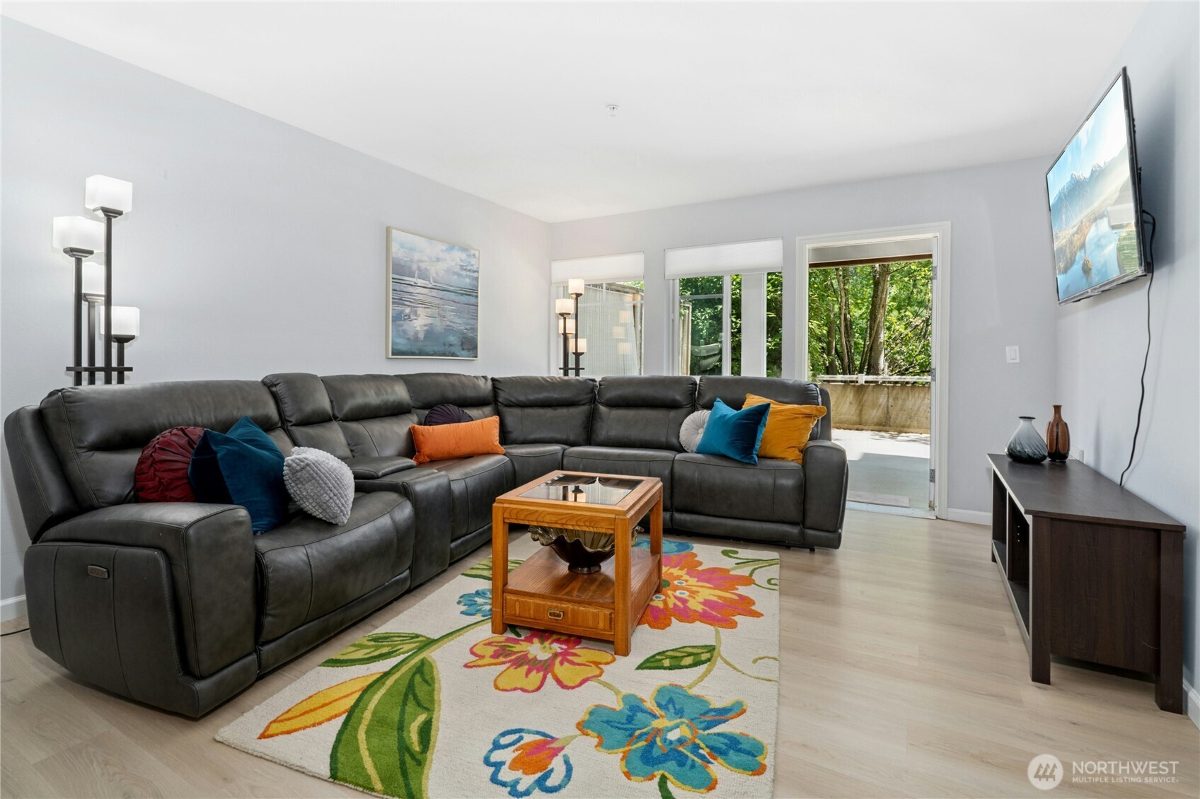17426 Bothell Way Northeast, Unit A105 Bothell, WA 98011 - Photo 5 of 29 a living room with furniture and a flat screen tv
