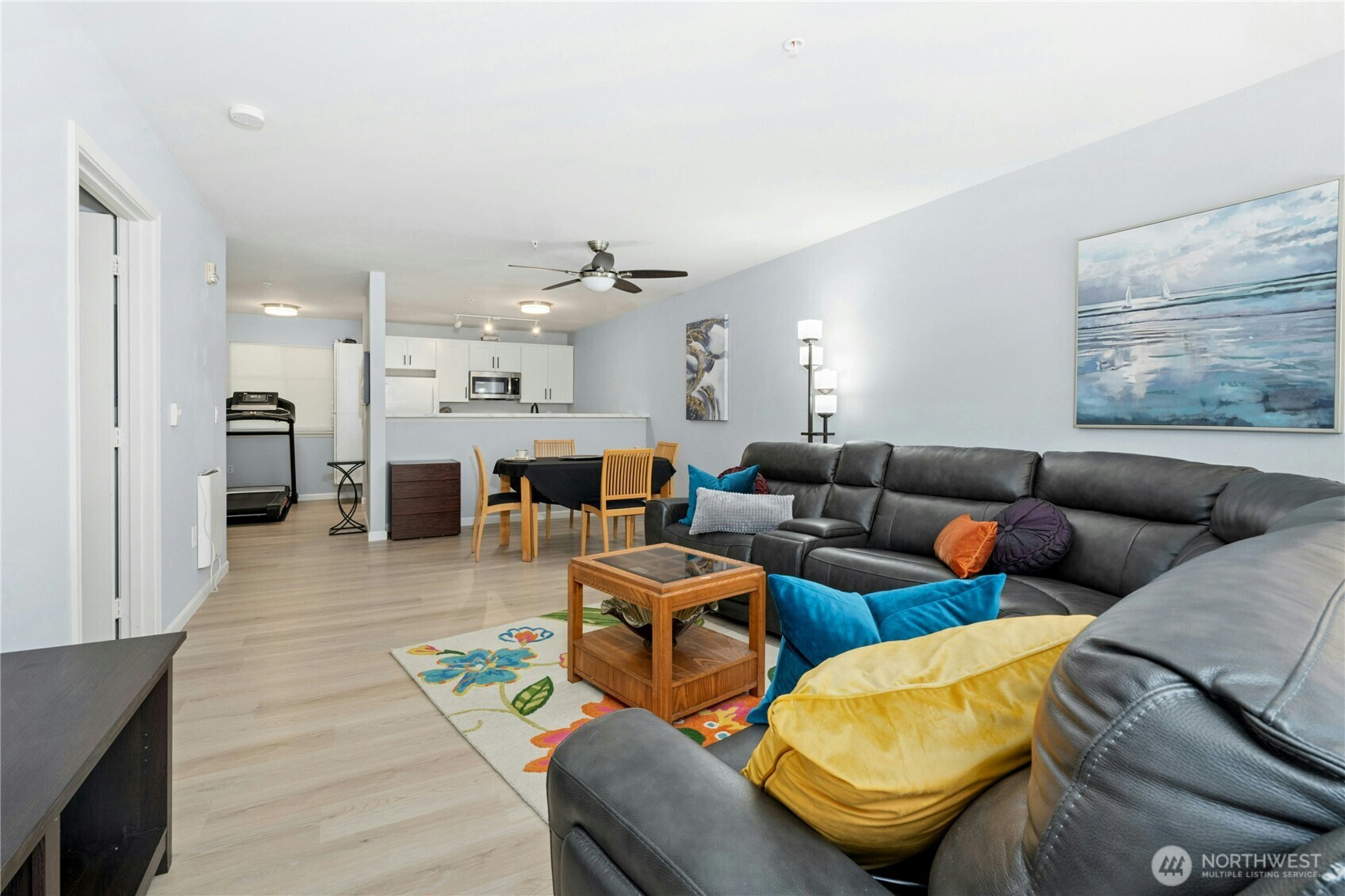 17426 Bothell Way Northeast, Unit A105 Bothell, WA 98011 - Photo 6 of 29 a living room with furniture and kitchen view