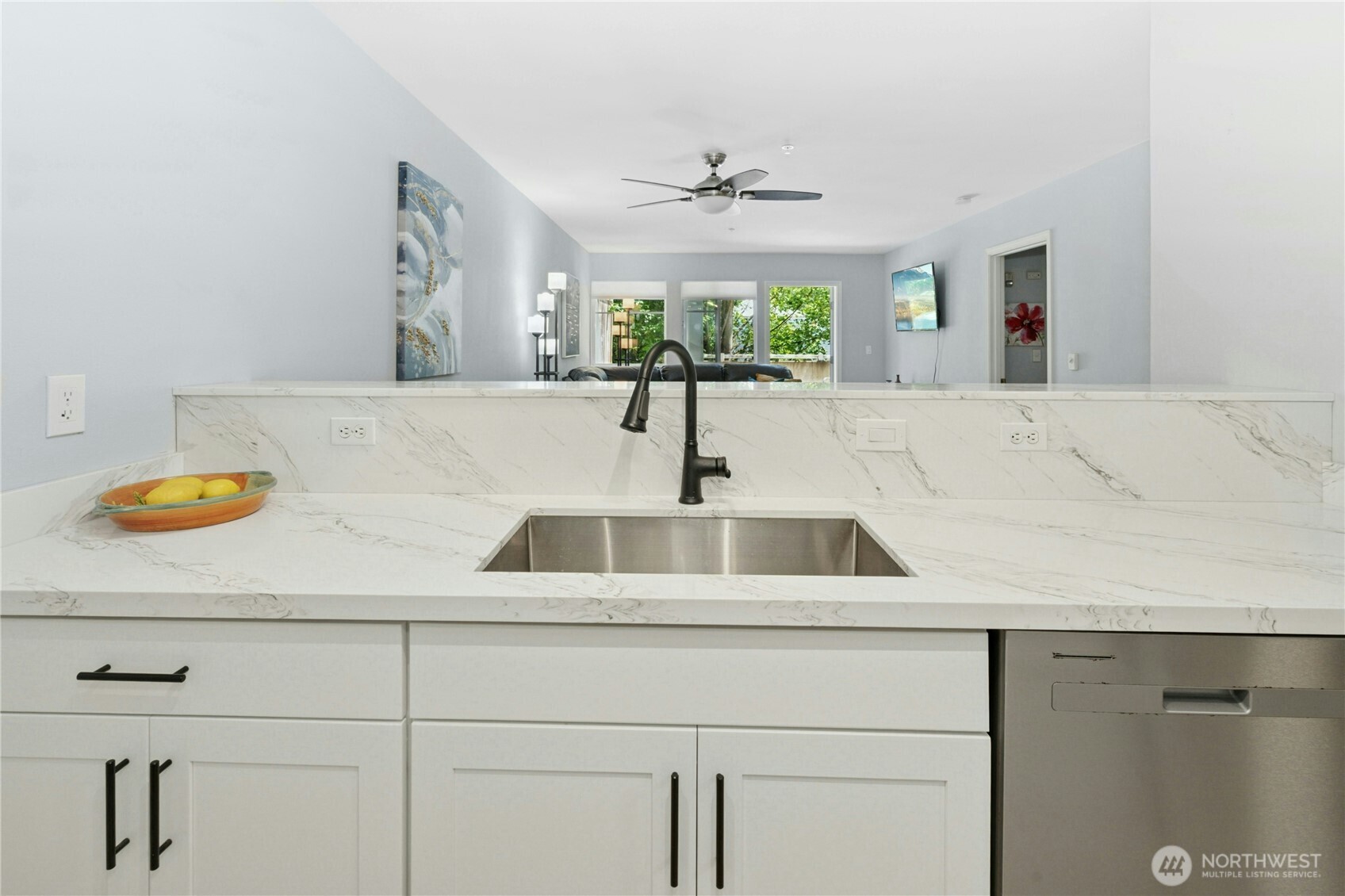 17426 Bothell Way Northeast, Unit A105 Bothell, WA 98011 - Photo 9 of 29 a kitchen with a sink and a potted plant