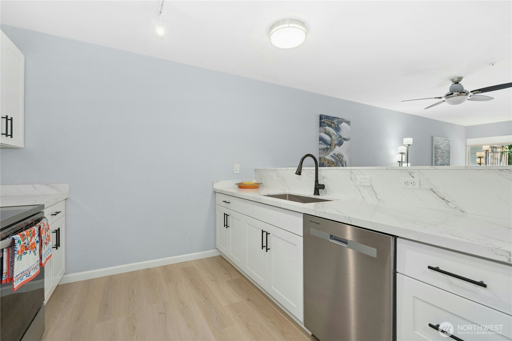 17426 Bothell Way Northeast, Unit A105 Bothell, WA 98011 - Photo 10 of 29 a kitchen with a sink and cabinets