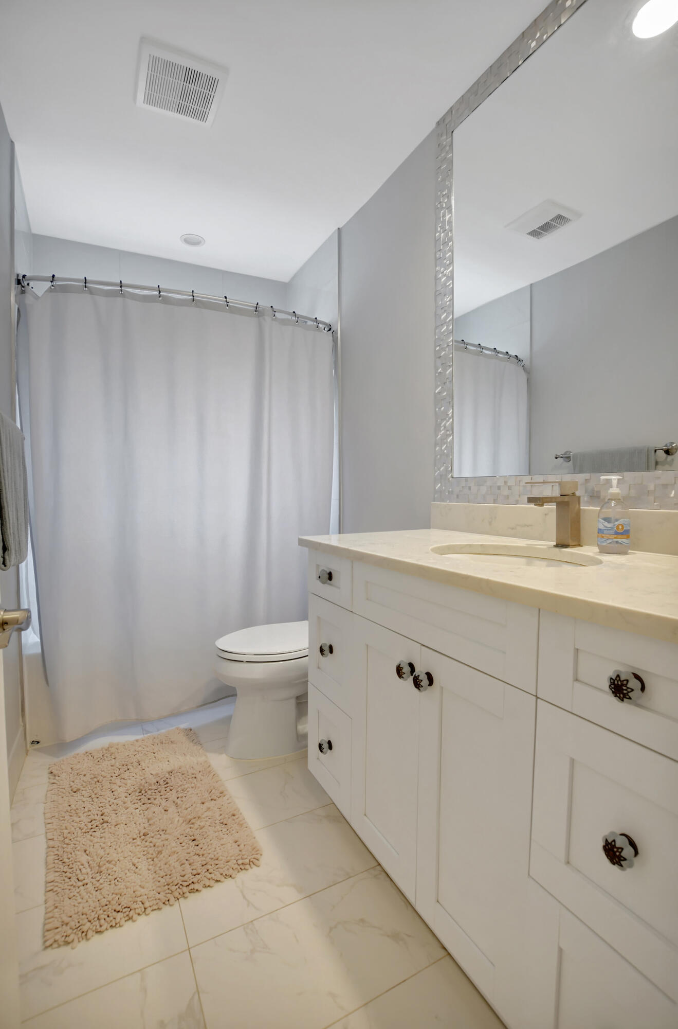 510 Silver Lane Boca Raton, FL 33432 - Photo 14 of 24 a bathroom with a sink a toilet and shower