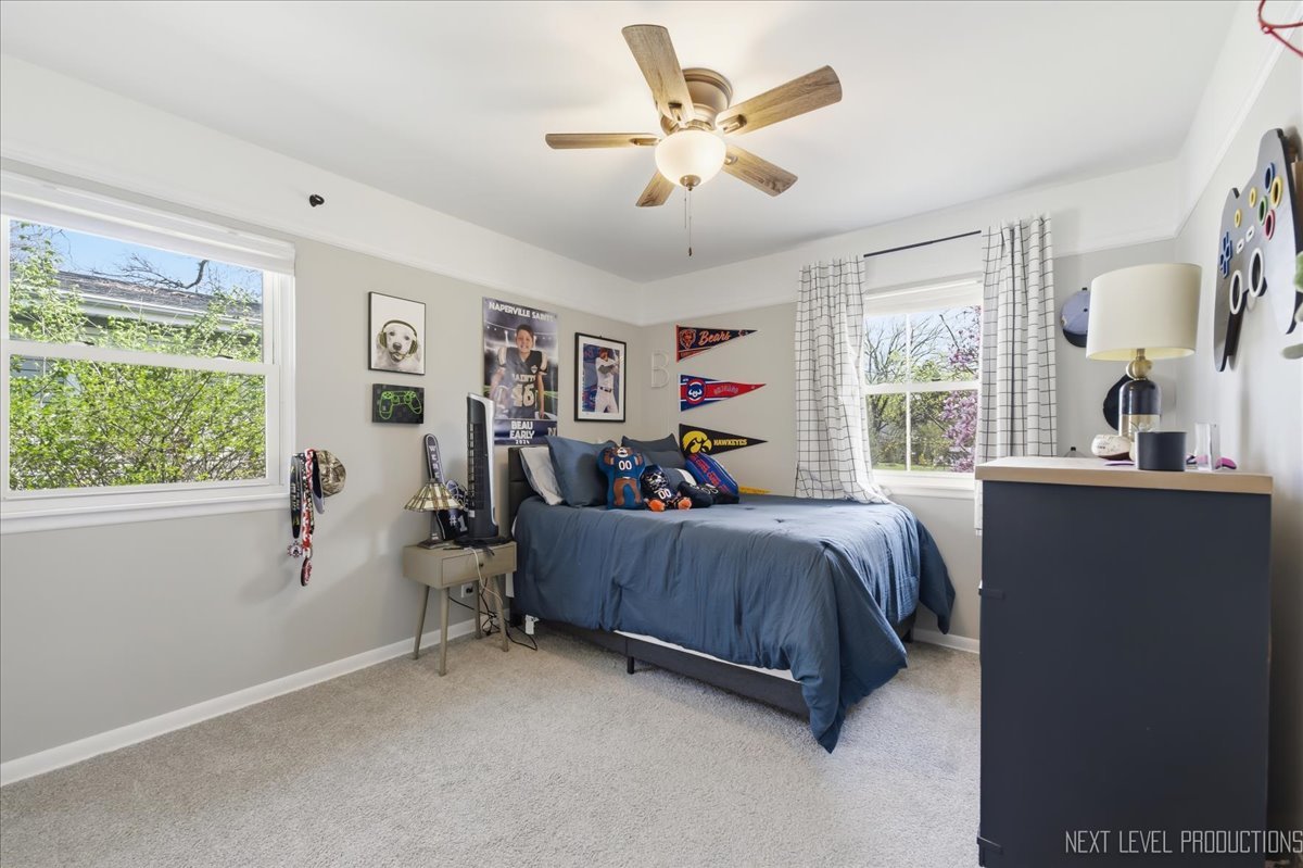 1209 Laurel Lane Naperville, IL 60540 - Photo 19 of 28 a bed room with a bed and a window