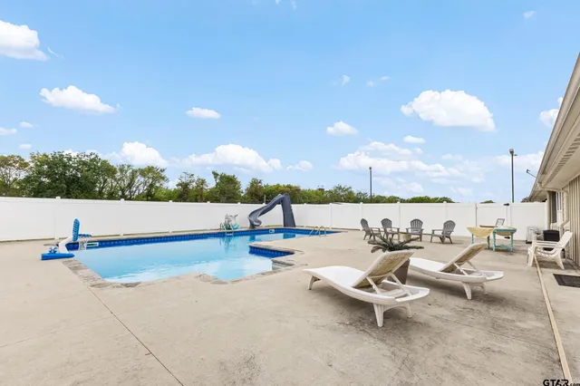 a terrace with outdoor seating and city view