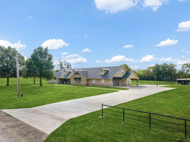 a view of a park with large trees