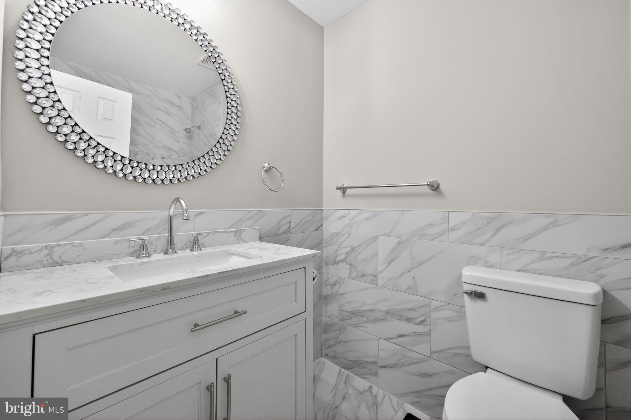 55 Adams Street Swedesboro, NJ 08085 - Photo 23 of 30 a bathroom with a toilet and a sink