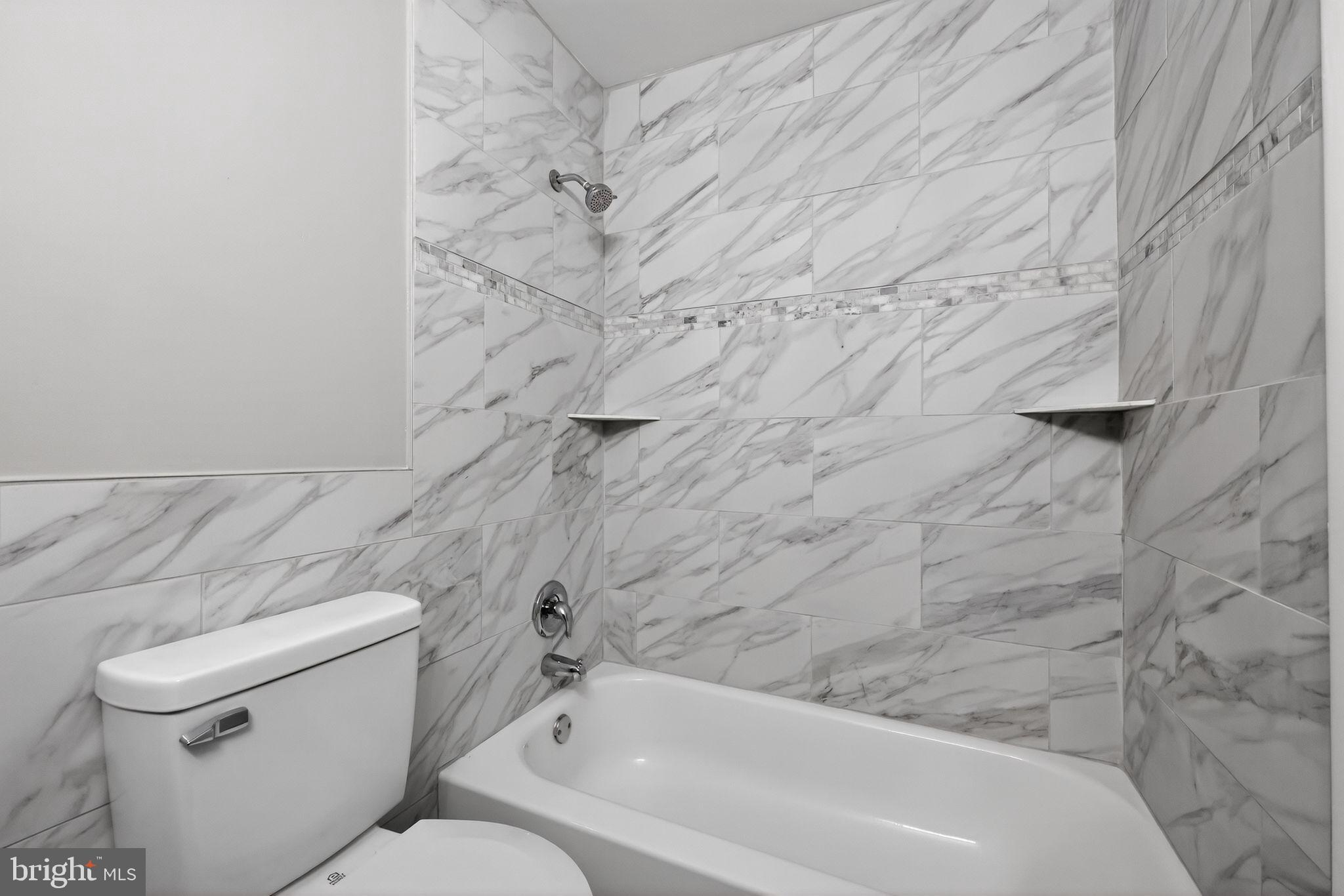 55 Adams Street Swedesboro, NJ 08085 - Photo 24 of 30 a bathroom with a toilet and a bathtub