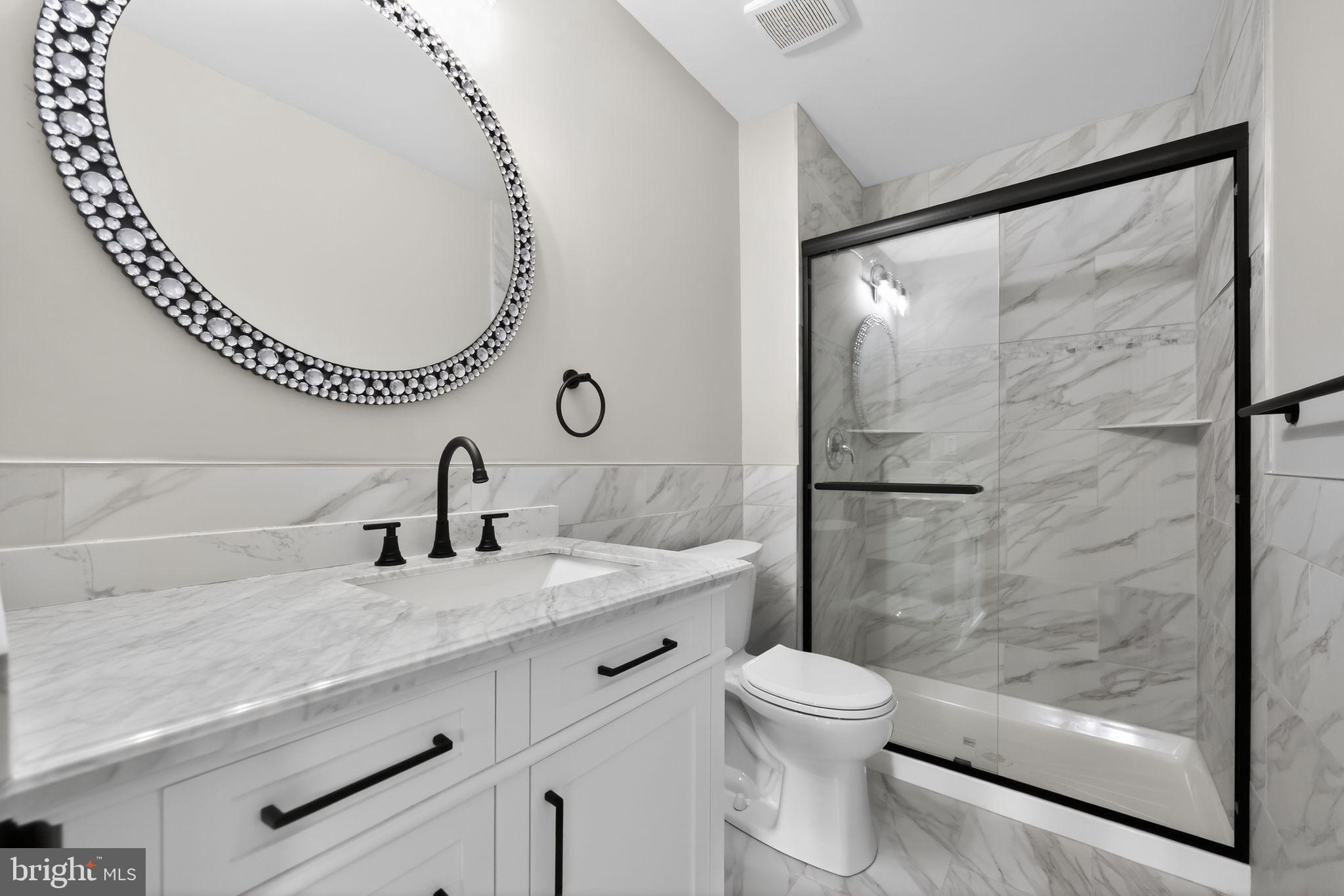 55 Adams Street Swedesboro, NJ 08085 - Photo 25 of 30 a bathroom with a granite countertop sink mirror toilet and shower