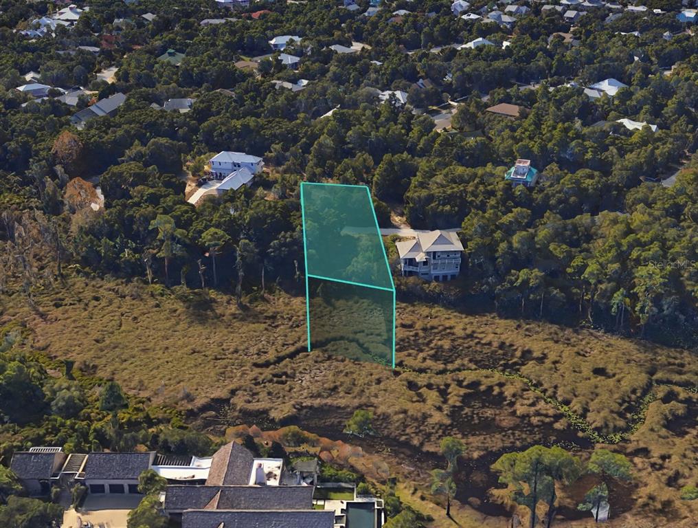 51 Cove Creek Lane Inlet Beach, FL 32461 - Photo 19 of 26 a backyard of a house with lots of green space