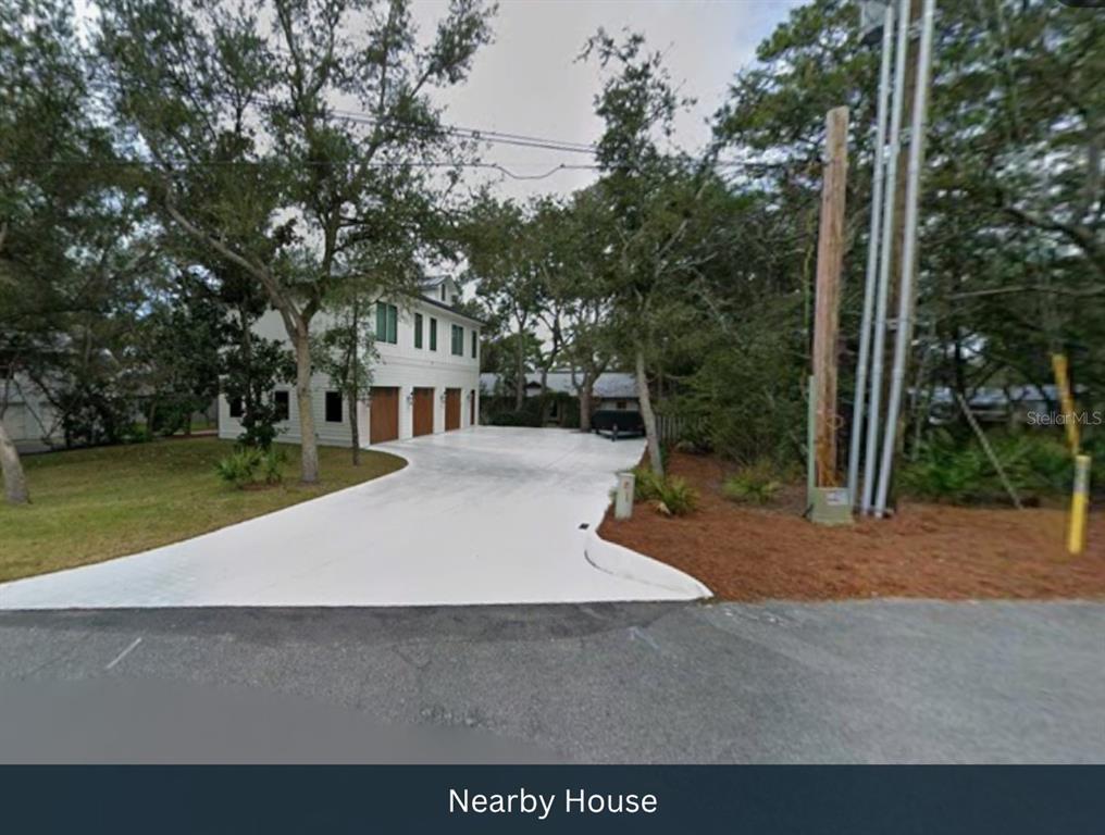 51 Cove Creek Lane Inlet Beach, FL 32461 - Photo 5 of 26 a house with trees in the background