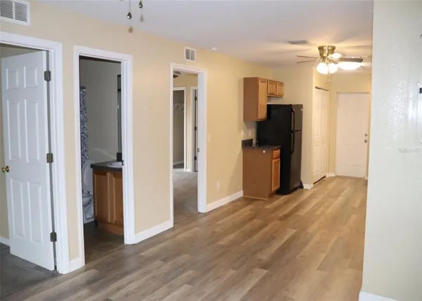 a view of a kitchen with a refrigerator and a stove
