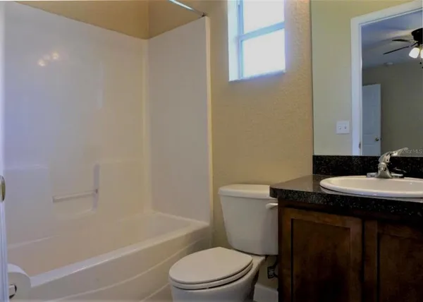 a bathroom with a sink a toilet and a bathtub
