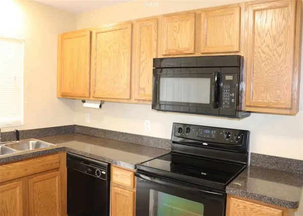 a kitchen with a stove and a microwave