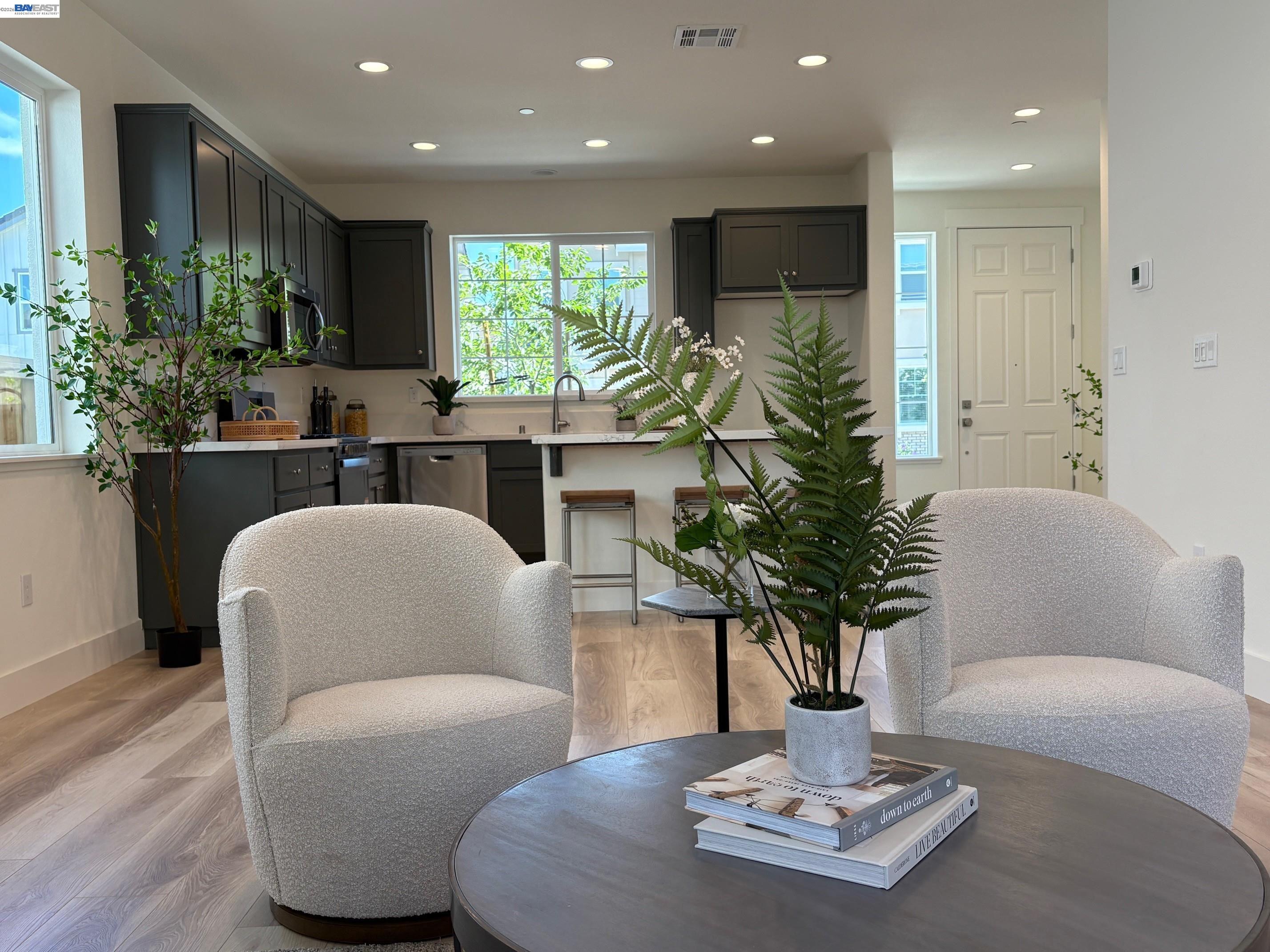 1476 Monument Lane Fairfield, CA 94533 - Photo 12 of 24 a living room with furniture potted plant and a large window