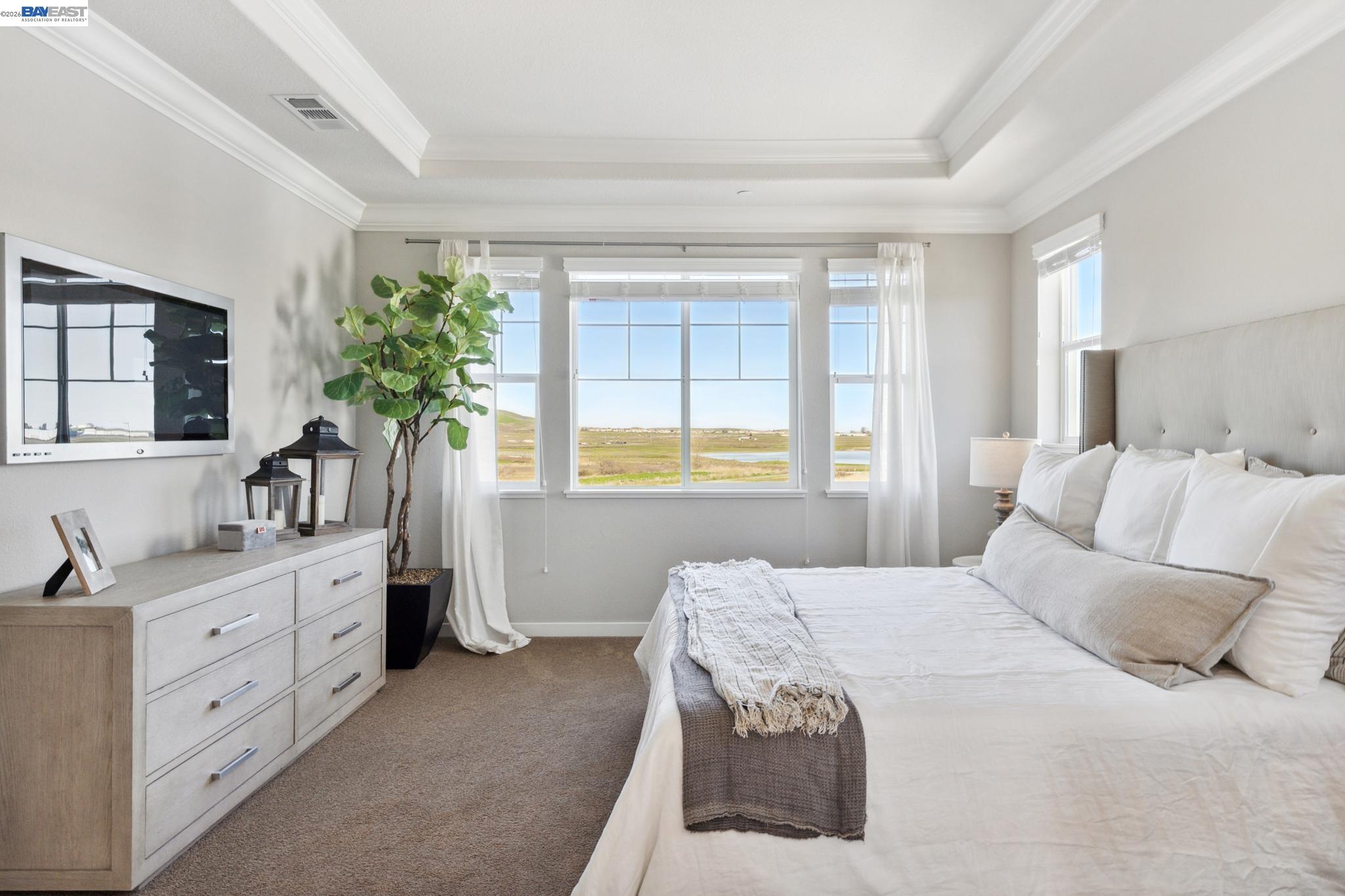 1476 Monument Lane Fairfield, CA 94533 - Photo 13 of 21 a bedroom with a bed and a potted plant on the dresser
