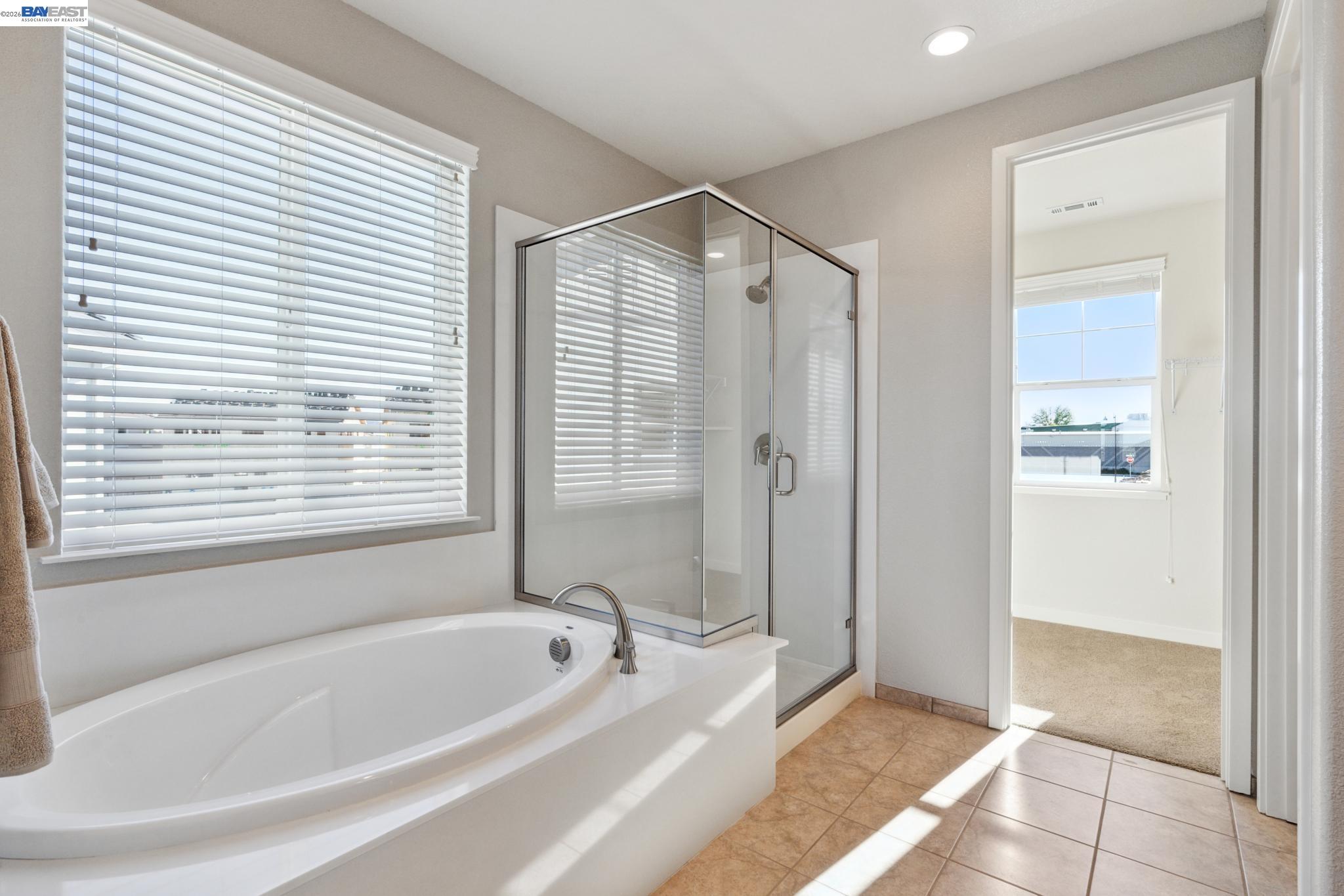 1476 Monument Lane Fairfield, CA 94533 - Photo 16 of 21 a bathroom with a bathtub and a shower
